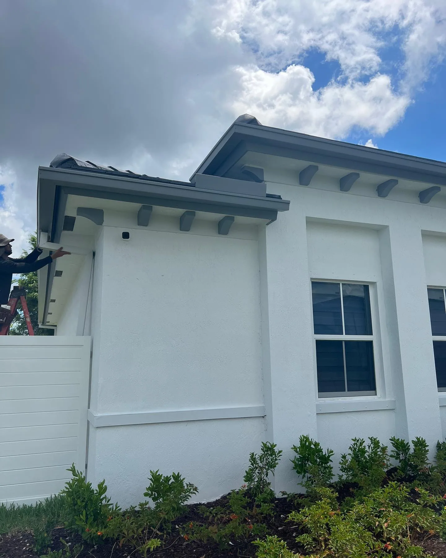 New-construction Florida home receiving seamless gutter installation