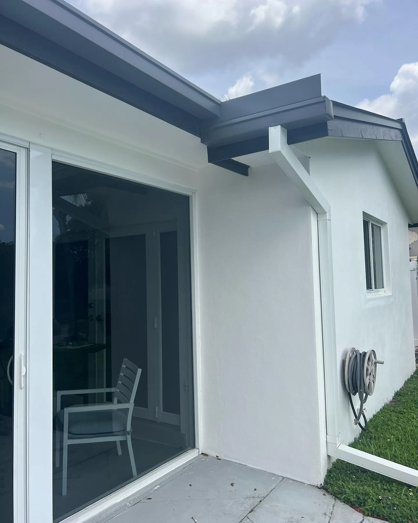 Commercial building gutters being maintained in Lee County, FL