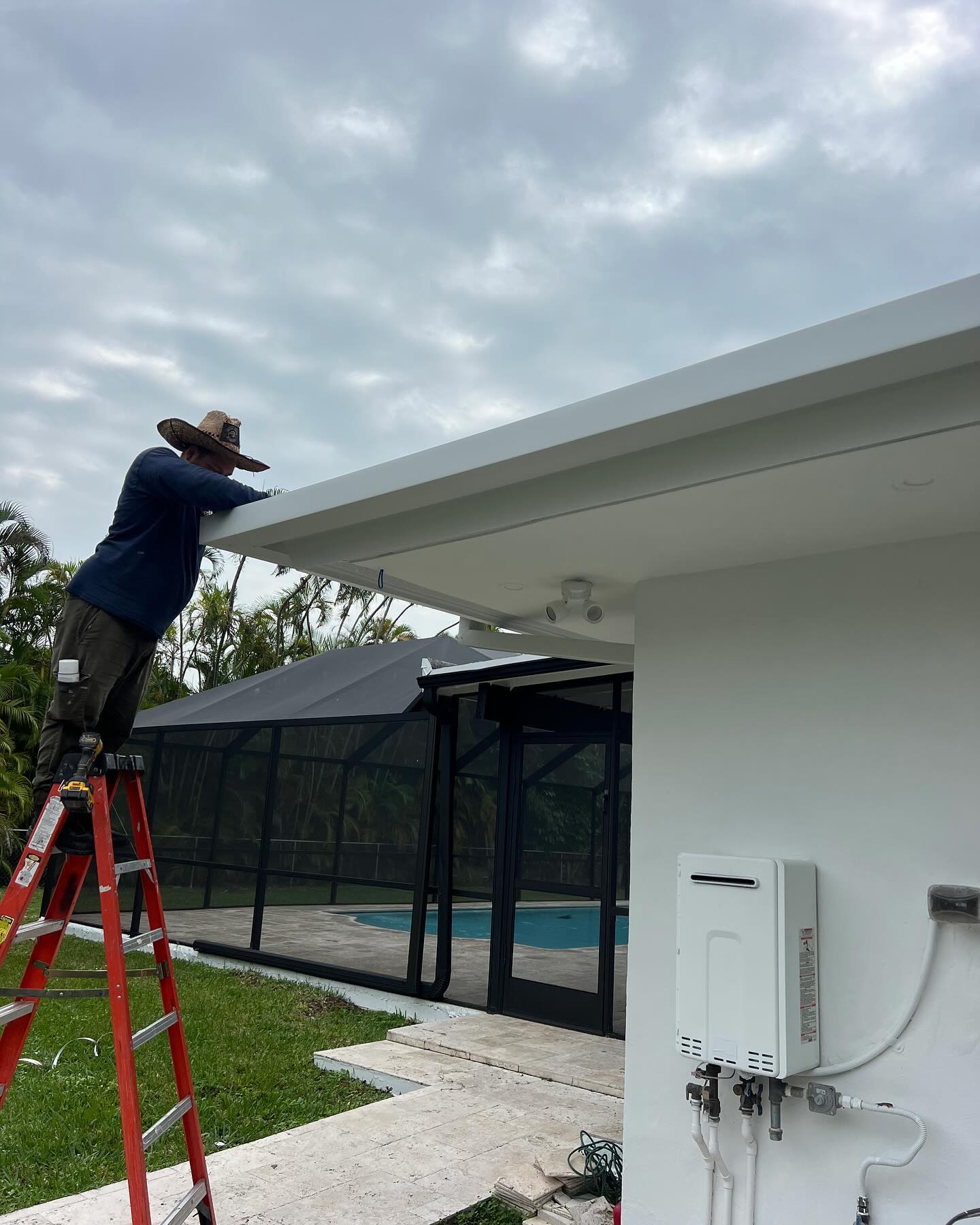 Gutter maintenance and inspection on a Southwest Florida home before storm season